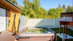 The secluded backyard has an amazing high-quality hot tub to soak.